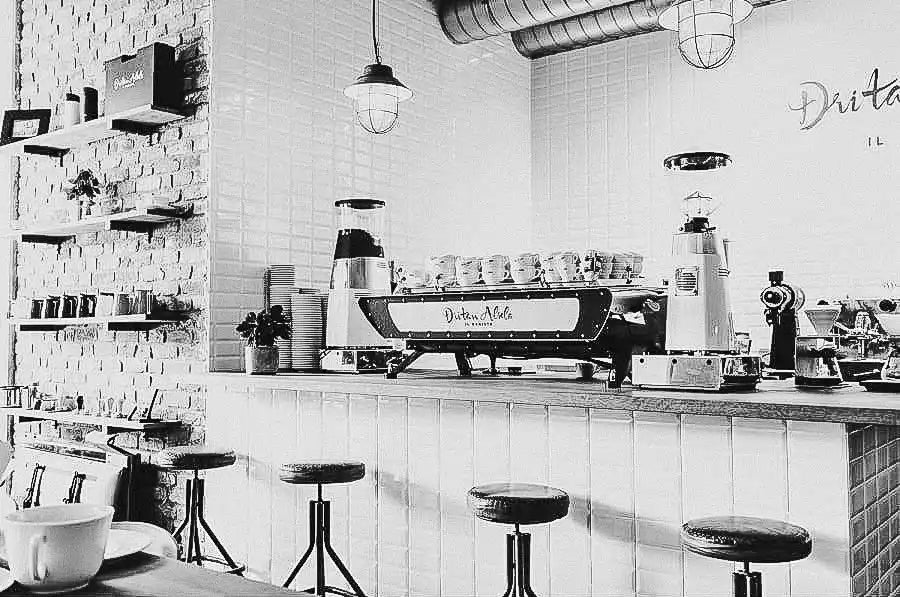 Coffee shop counter with espresso machine.
