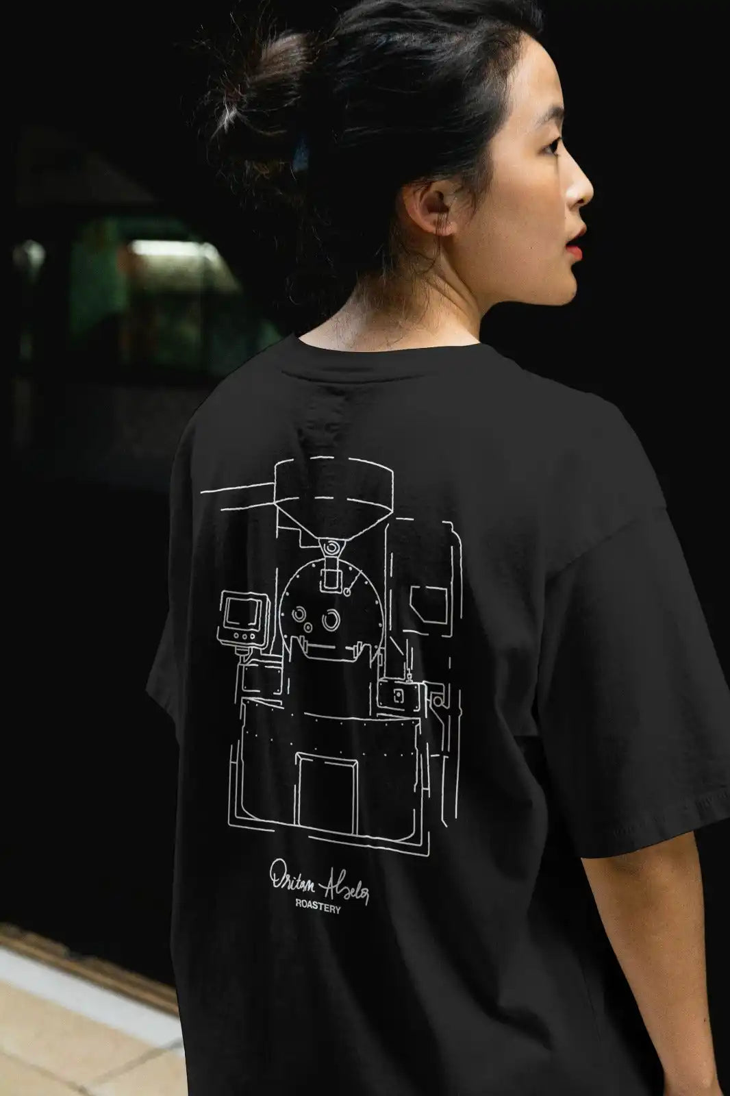 Black t-shirt with a white line drawing of a coffee machine on the back.