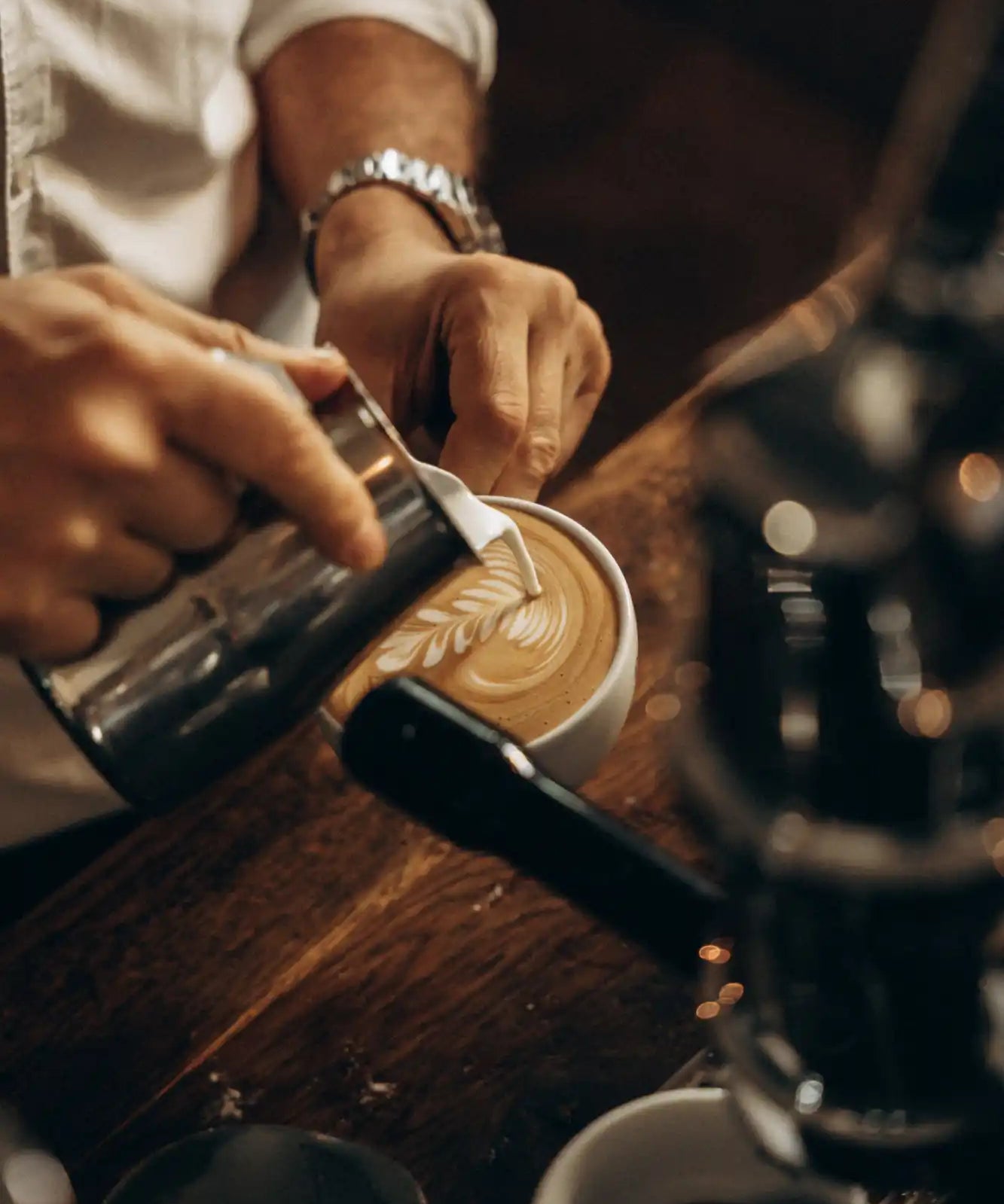 Latte art being poured.