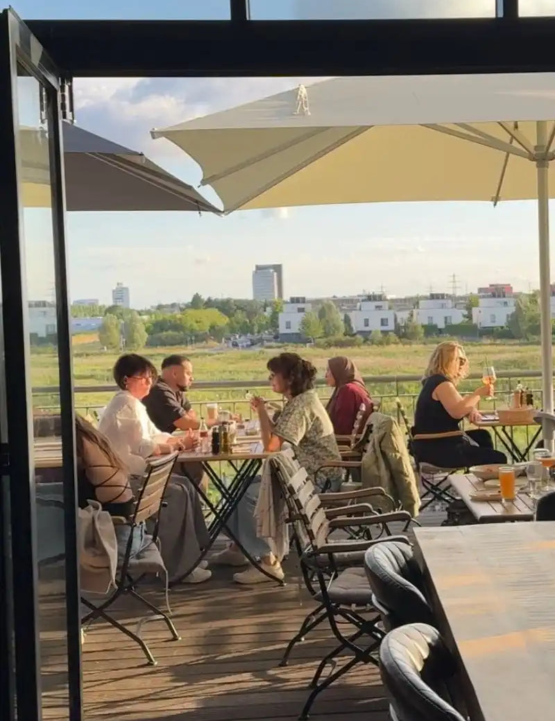 Outdoor restaurant patio with dining customers.
